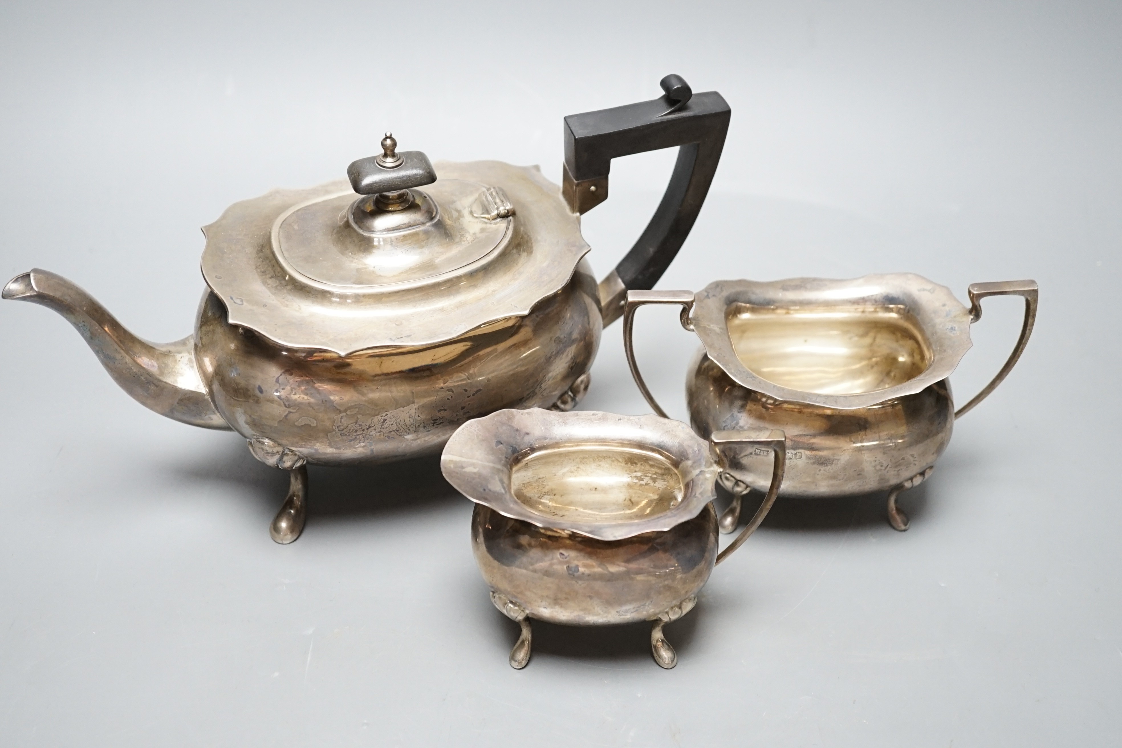 A George V silver three piece tea set, by Walker & Hall, Sheffield, 1926, gross weight 30.3oz.